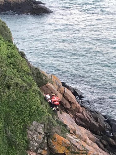 St Catherine's ILB assists casualty that had fallen on to rocks at Gorey image2